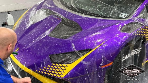 Purple Lamborghini Hurrican STO has paint protection film applied to the hood for rock chip protection by Greg Gellas of Signature Detailing NJ.